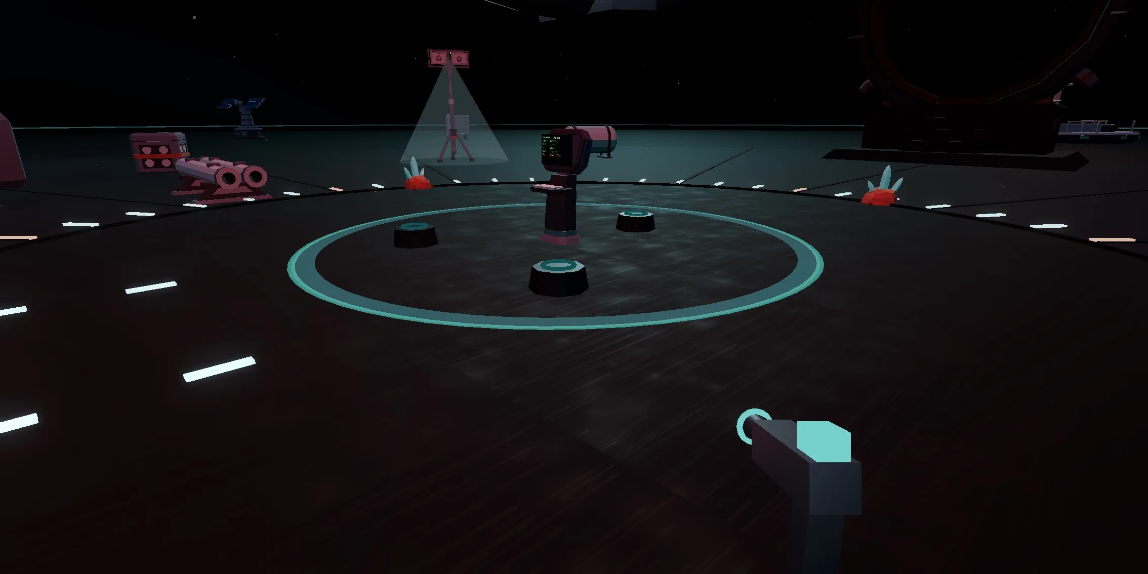 The platform on the deck, seen from the north and slightly above. Three empty seats stand inside a teal painted ring, all of them cold, with the deck-net console beside them.