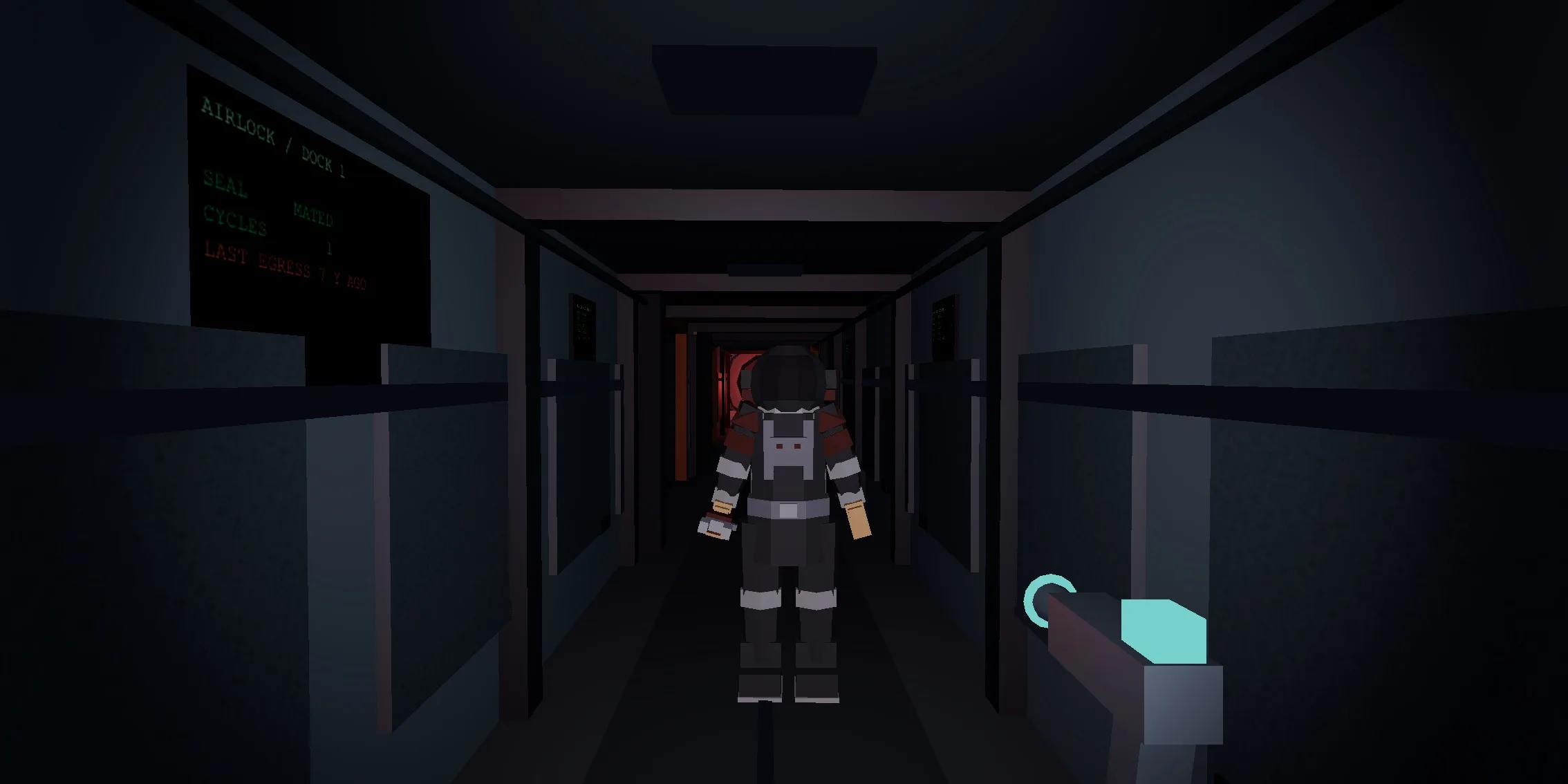 A crew member in a suit standing four metres from the camera in the dark corridor, turned to face it with its head lifted to a level gaze. The airlock board is on the wall behind it.